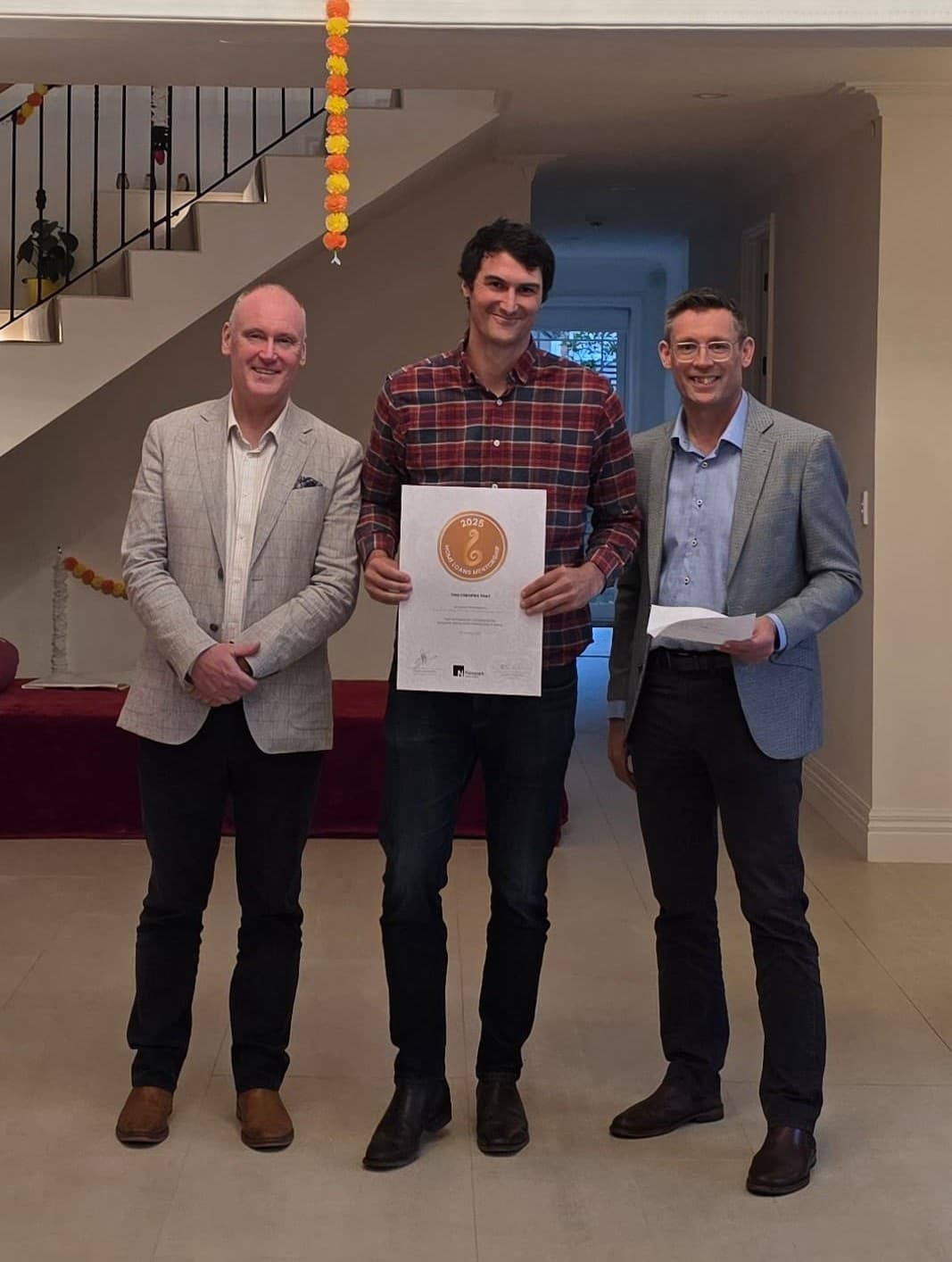 A new adviser receiving his Newpark Academy certificate