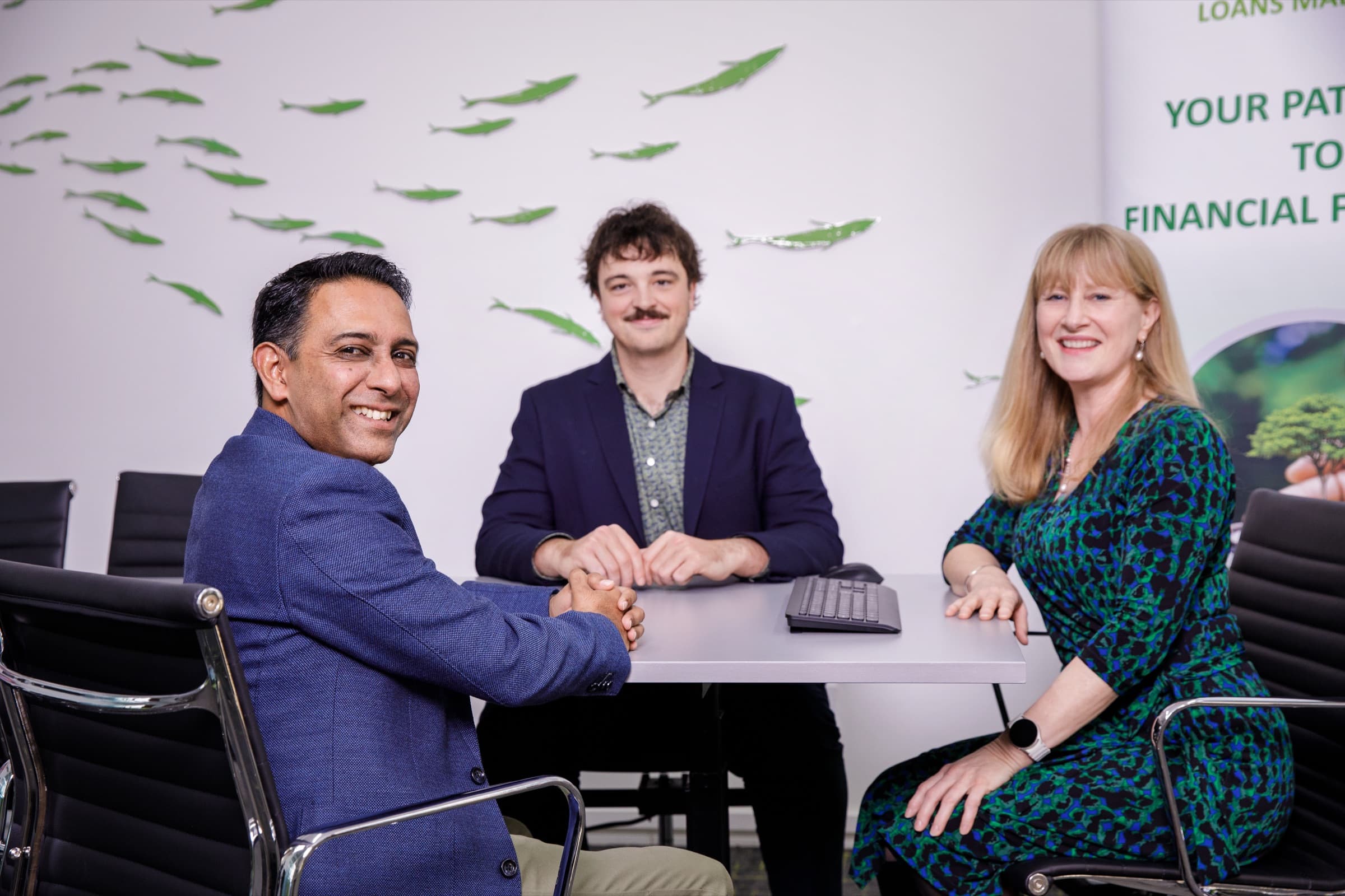 Three Newpark advisers meeting around a table